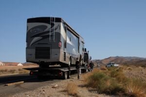 Loaded RV on Flatbed Tow Truck For Special Vehicle Towing Service