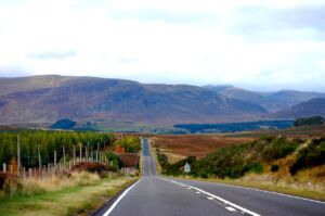 Road Driving Through Foothills During Long Distance Transportation Call